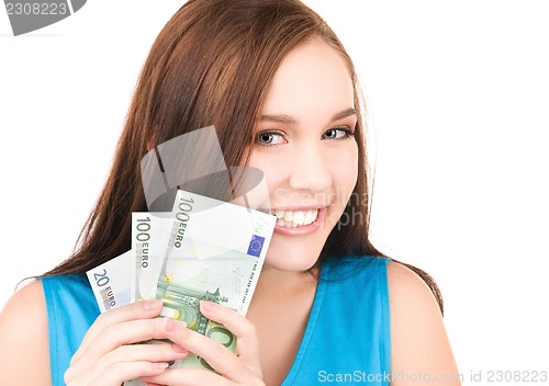 Image of lovely teenage girl with money