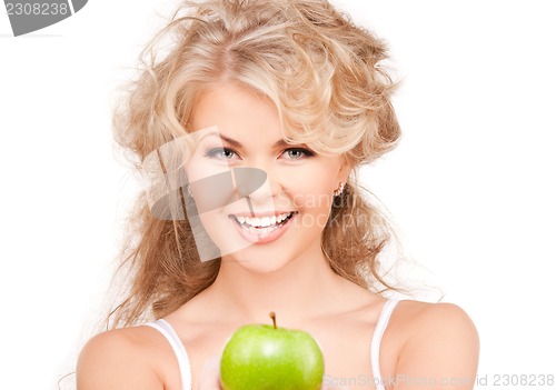 Image of young beautiful woman with green apple
