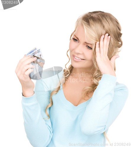 Image of lovely woman with purse and money