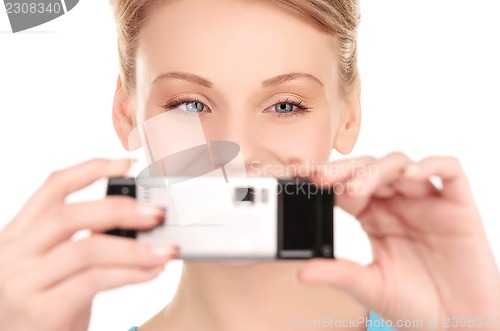 Image of happy woman using phone camera
