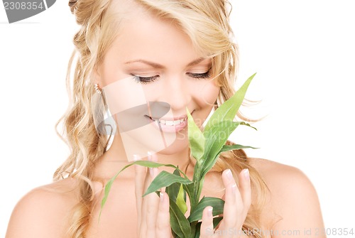 Image of woman with bamboo