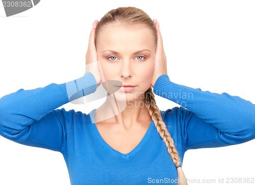 Image of woman with hands on ears