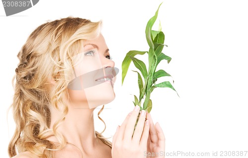 Image of woman with bamboo