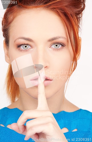 Image of finger on lips