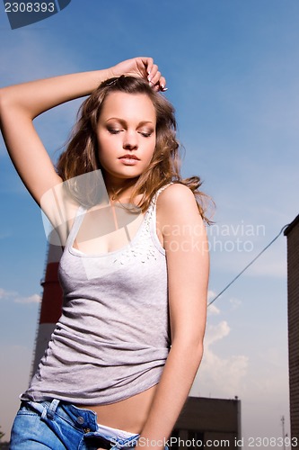 Image of young sexy woman in blue jeans