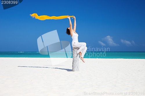 Image of happy woman on the beach