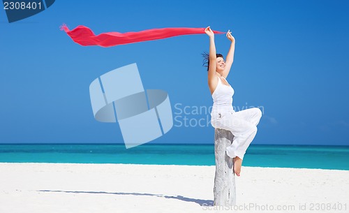 Image of happy woman on the beach