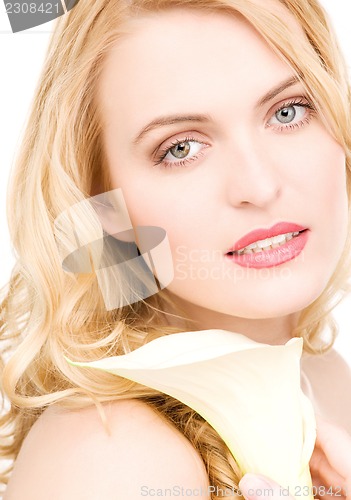 Image of beautiful woman with white flower