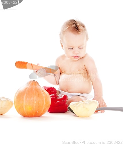 Image of baby boy with vegetables