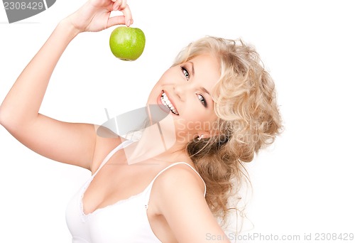 Image of young beautiful woman with green apple