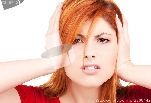 Image of unhappy redhead woman