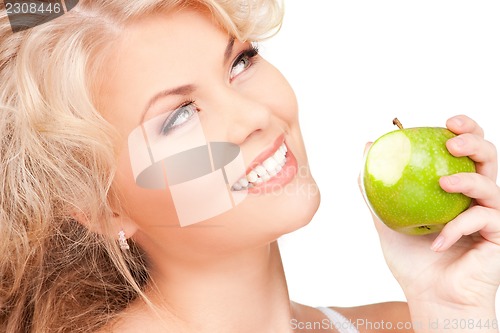 Image of young beautiful woman with green apple