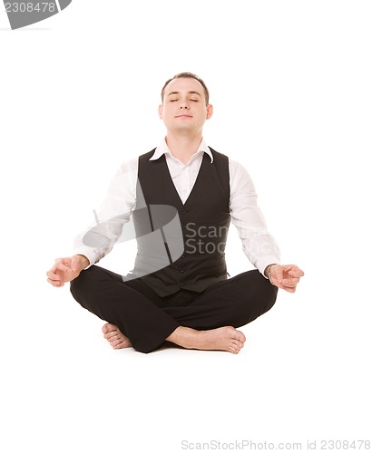 Image of businessman sitting in lotus pose