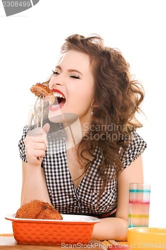 Image of young attractive woman in the kitchen