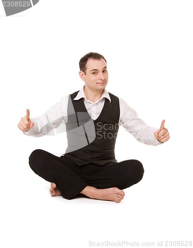 Image of businessman sitting in lotus pose