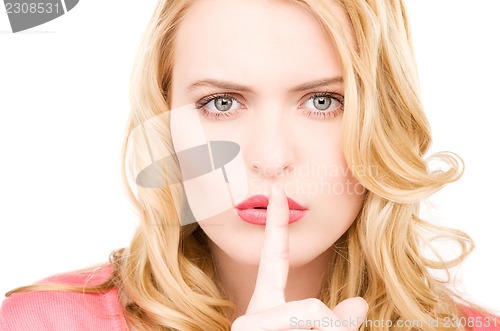 Image of finger on lips