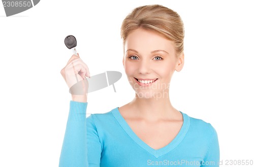 Image of happy woman with car key