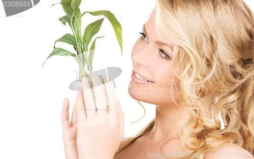 Image of woman with bamboo