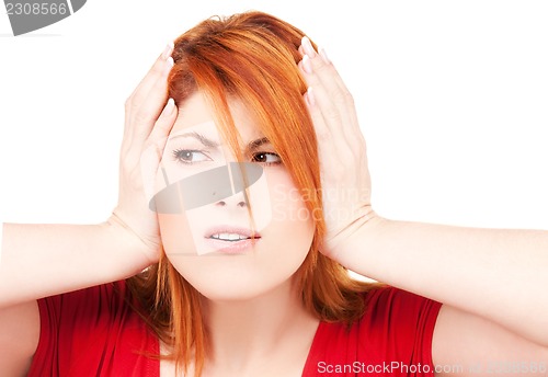 Image of unhappy redhead woman