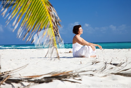 Image of happy woman on the beach