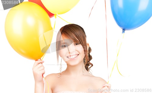 Image of happy teenage girl with balloons