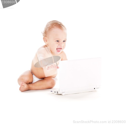 Image of baby boy with laptop computer