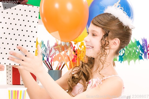 Image of party girl with balloons and gift box