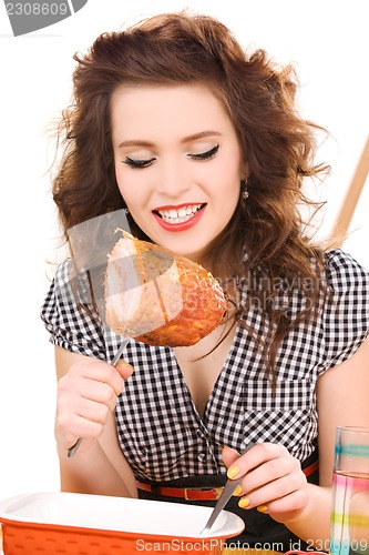 Image of young attractive woman in the kitchen