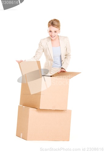 Image of businesswoman with boxes