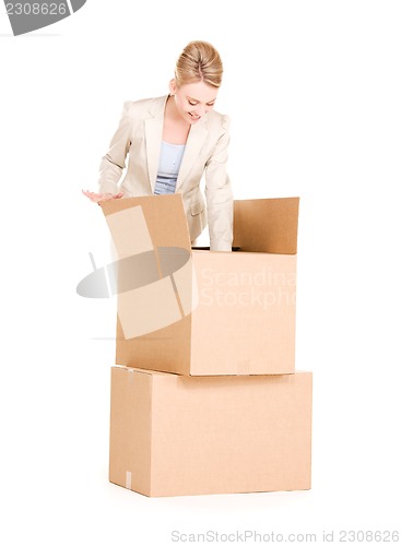 Image of businesswoman with boxes