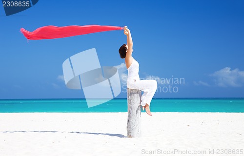 Image of happy woman on the beach