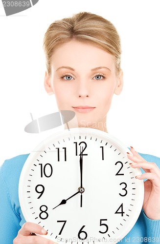 Image of woman holding big clock