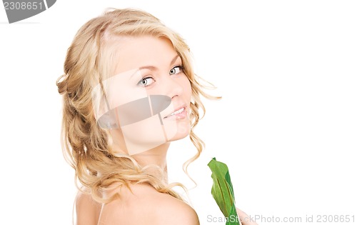 Image of woman with green leaf