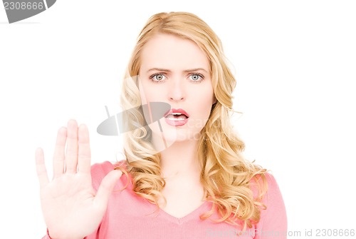 Image of woman making stop gesture