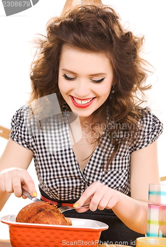Image of young attractive woman in the kitchen