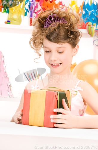 Image of party girl with balloons and gift box