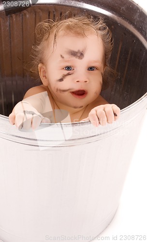 Image of baby in trash can