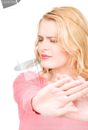 Image of young woman making stop gesture