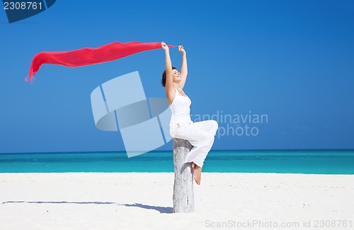 Image of happy woman on the beach