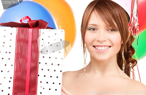 Image of party girl with balloons and gift box