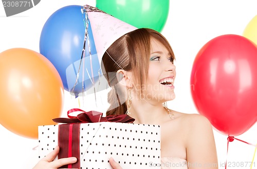Image of party girl with balloons and gift box