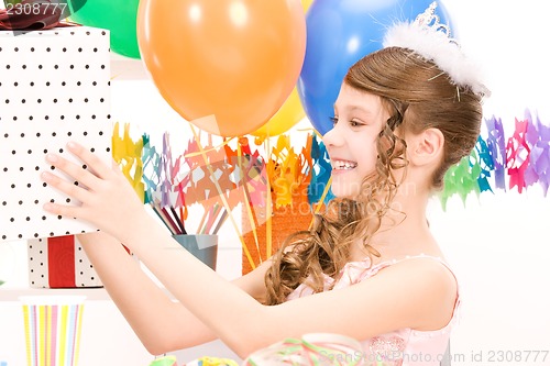 Image of party girl with balloons and gift box