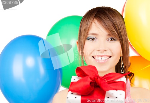 Image of party girl with balloons and gift box