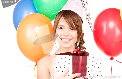 Image of party girl with balloons and gift box