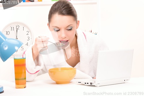 Image of eating woman laptop computer