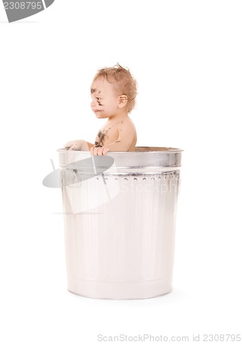 Image of baby in trash can