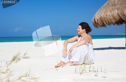 Image of happy woman on the beach