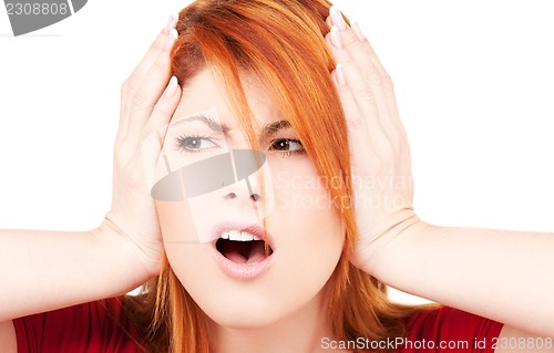 Image of unhappy redhead woman