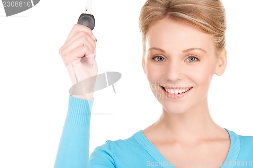 Image of happy woman with car key