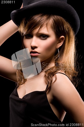 Image of woman in black dress and top hat